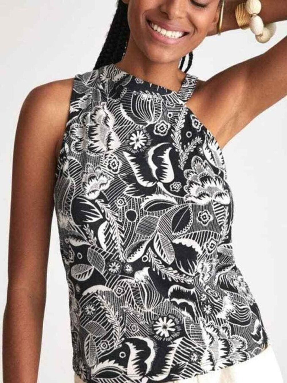 Anthropologie asymmetrical cutout tank top in a black and white floral motif